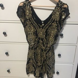 Gold and black sequins romper